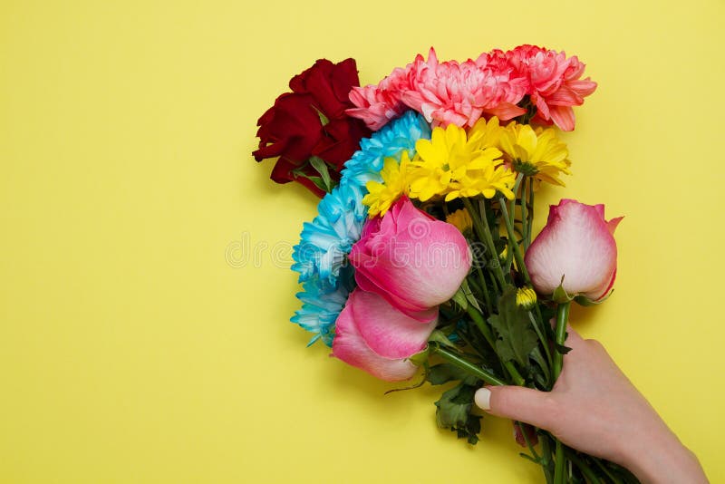 Send flowers online concept. Flower delivery for valentine and mother day. Bouquet of red pink roses isolated on violet background