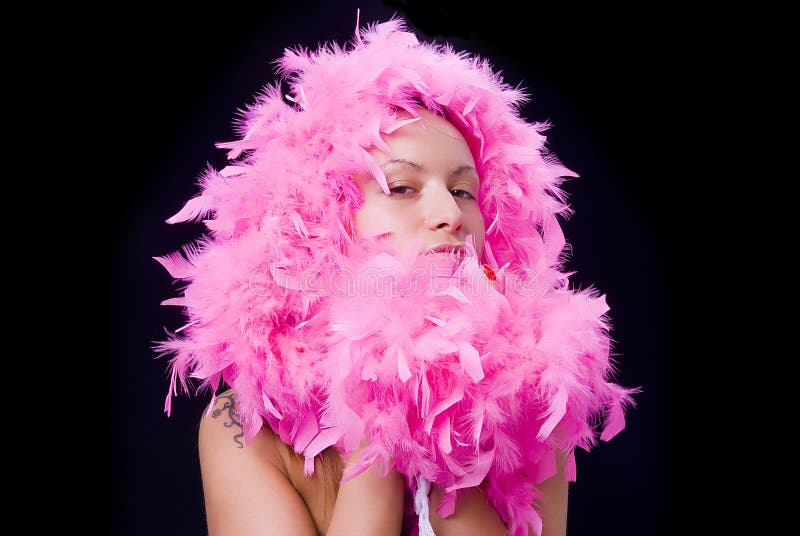 Beautiful woman with pink feather boa, tattoo, on black background. Beautiful woman with pink feather boa, tattoo, on black background