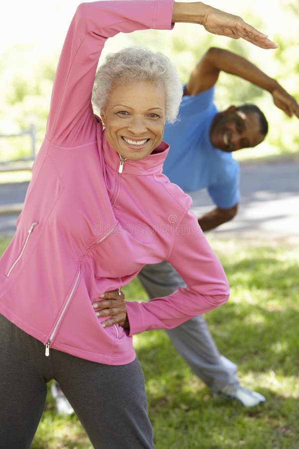 Senior African American Couple Exercising In Park stock photography Senior African American Couple Exercising In Park stock photography