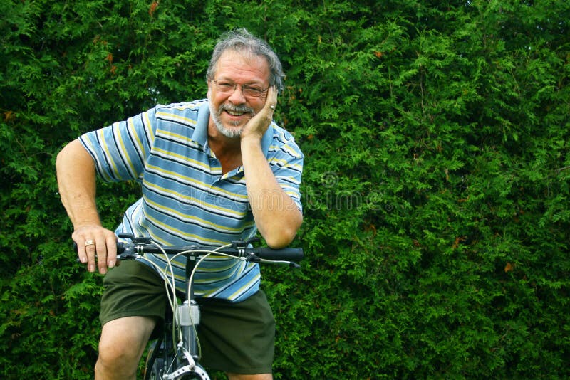 Senior and bicycle. Happy senior man with a bicycle Senior and bicycle. Happy senior man with a bicycle