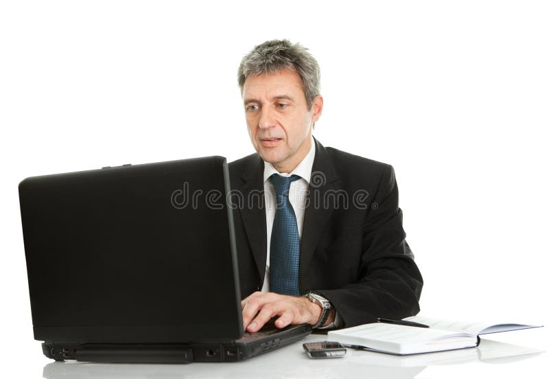 Senior business man working on laptop