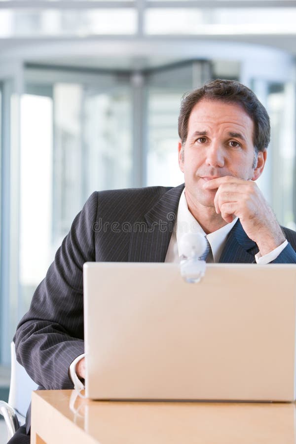 Senior business man working on laptop