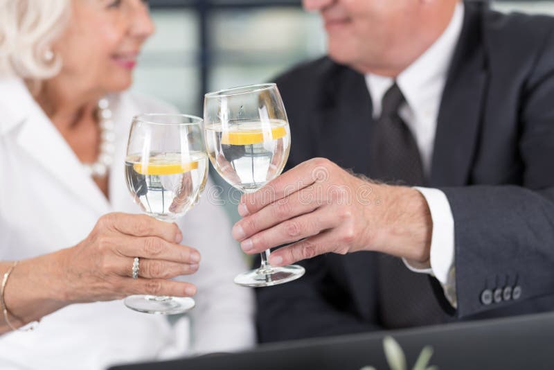 Senior business pair celebrating royalty free stock photo Senior business pair celebrating royalty free stock photo