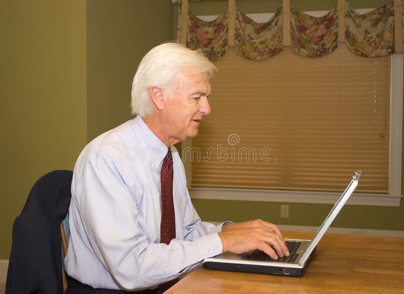 Senior Businessman on Laptop