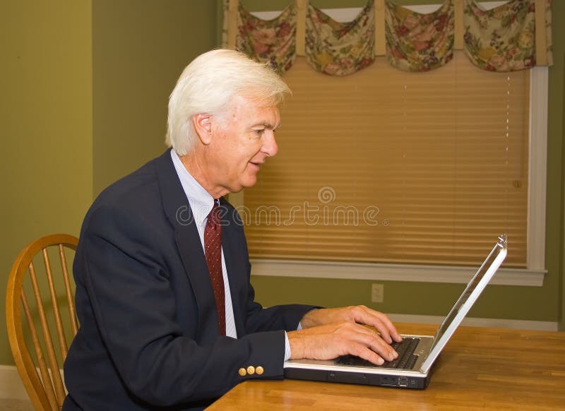 Senior Businessman on Laptop