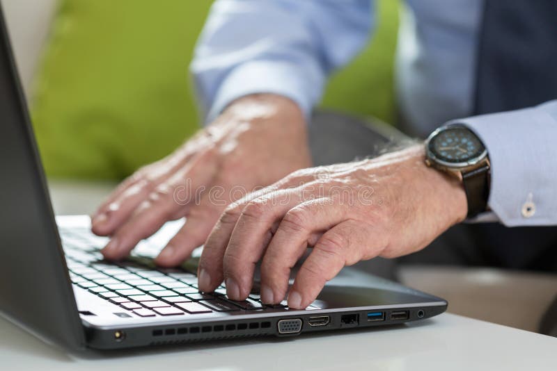 Senior businessman uses laptop for work royalty free stock photos Senior businessman uses laptop for work royalty free stock photos