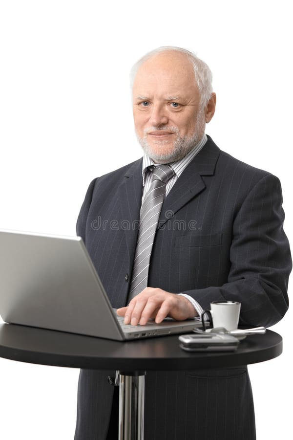 Senior businessman using computer royalty free stock photography