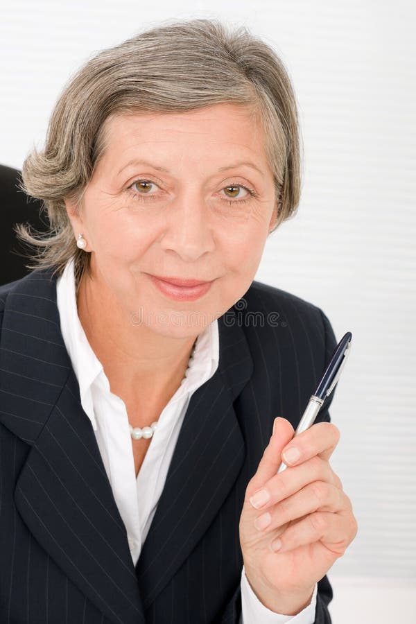 Senior businesswoman professional hold pen