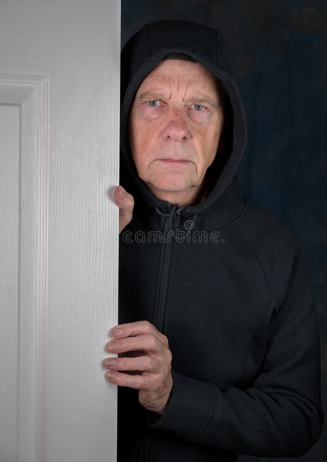 Senior caucasian man greeting visitor at doorway stock images Senior caucasian man greeting visitor at doorway stock images