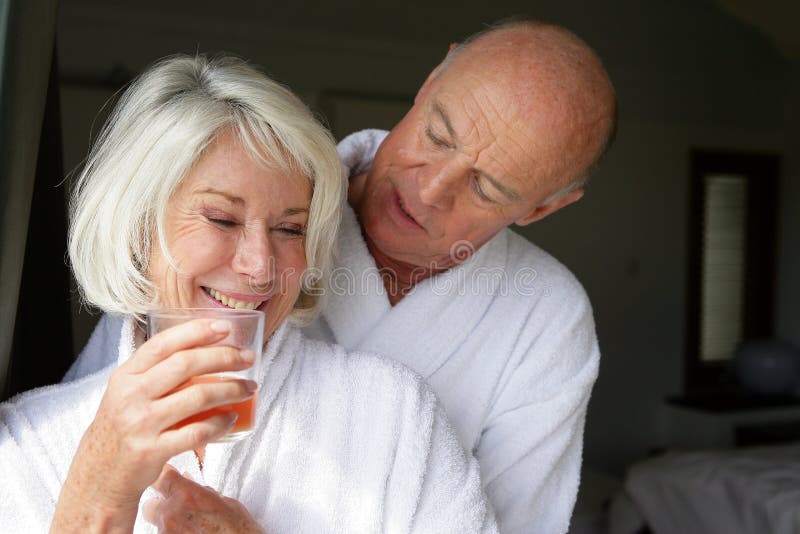 Senior couple in bathrobe stock image. Image of peace 10496145