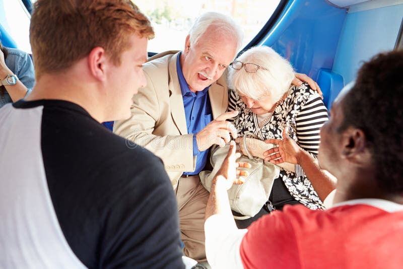 Senior Couple Being Harassed On Bus Journey royalty free stock photo Senior Couple Being Harassed On Bus Journey royalty free stock photo