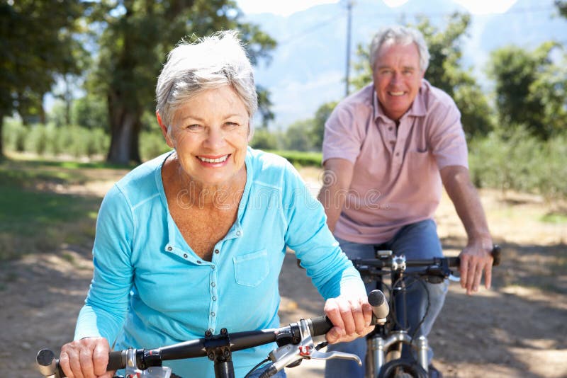 Senior couple on bike ride royalty free stock photography