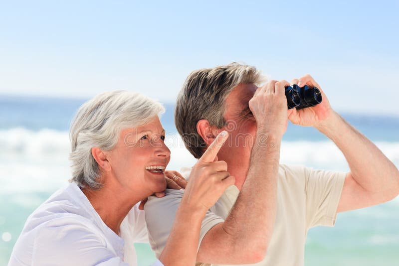 Senior couple bird watching