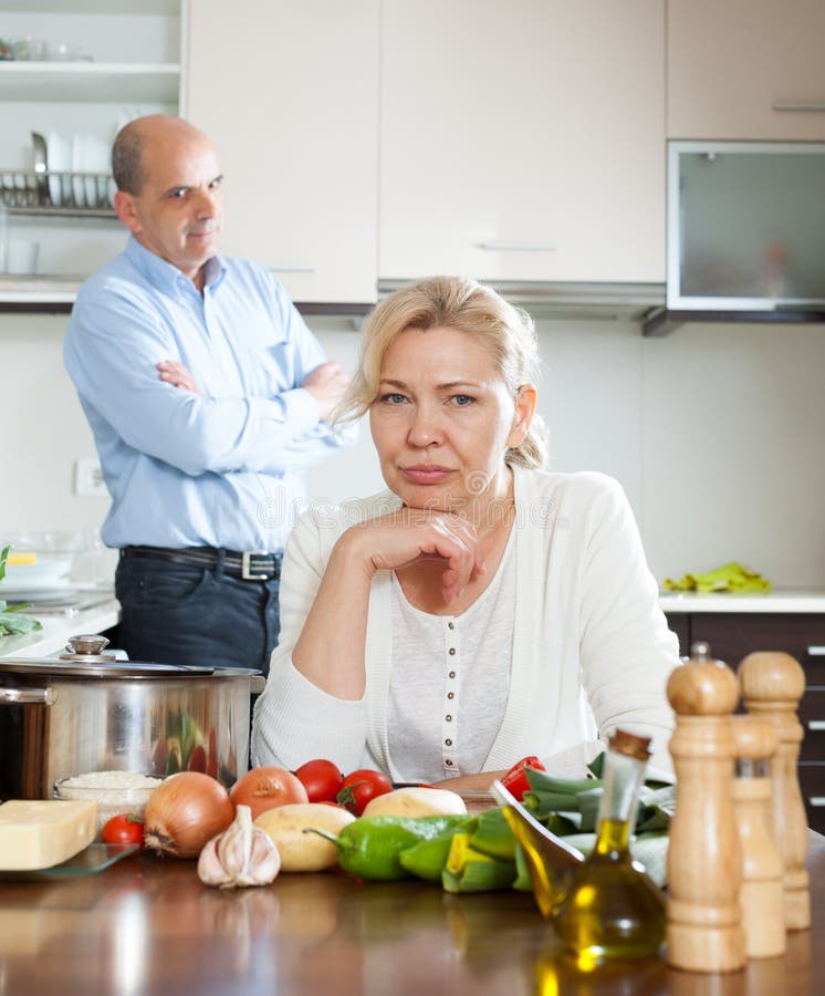 Senior couple conflicted at kitchen royalty free stock photography Senior couple conflicted at kitchen royalty free stock photography