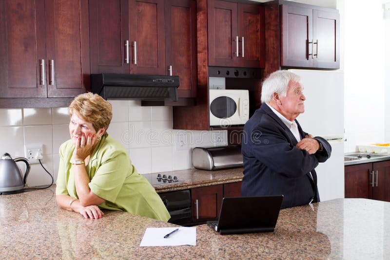 Senior couple divorce concept: unhappy senior couple at home
