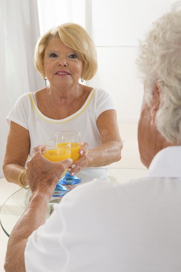 Senior Couple Drinking Juice Stock Photo Image of adult, senior 46653130