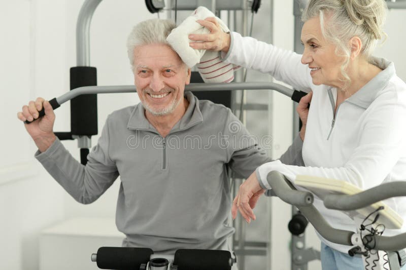 Senior Couple Exercising In Gym Together Stock Image Image Of