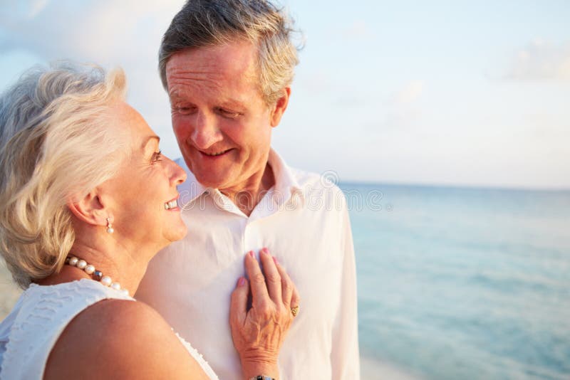 Senior Couple Getting Married In Beach Ceremony