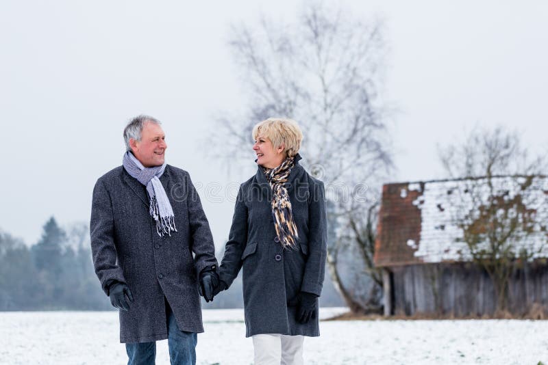 Senior couple having walk in winter royalty free stock photos Senior couple having walk in winter royalty free stock photos