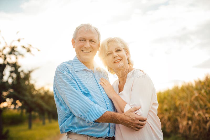 Senior couple hugging each other outdoors royalty free stock photos Senior couple hugging each other outdoors royalty free stock photos