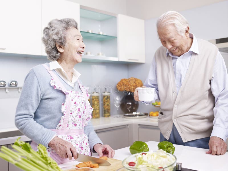 Senior couple in kitchen stock images Senior couple in kitchen stock images