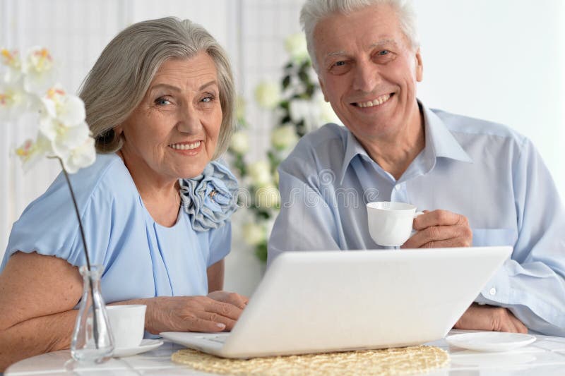 Senior couple with laptop