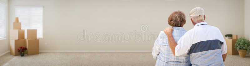 Loving Senior Couple Looking Inside Room with Boxes Banner. royalty free stock photography Loving Senior Couple Looking Inside Room with Boxes Banner. royalty free stock photography