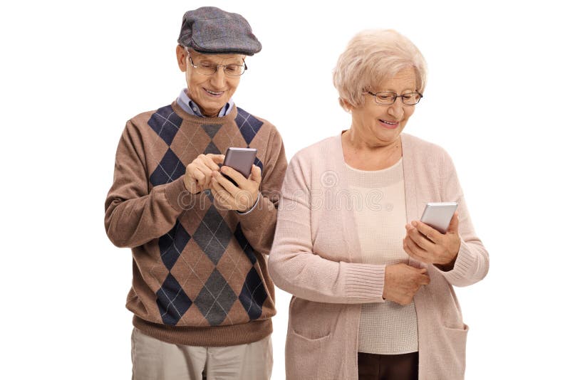 Senior couple looking at phones stock image Senior couple looking at phones stock image