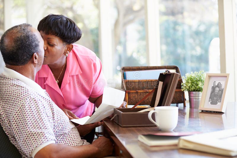 Senior Couple Putting Letter Into Keepsake Box royalty free stock image Senior Couple Putting Letter Into Keepsake Box royalty free stock image