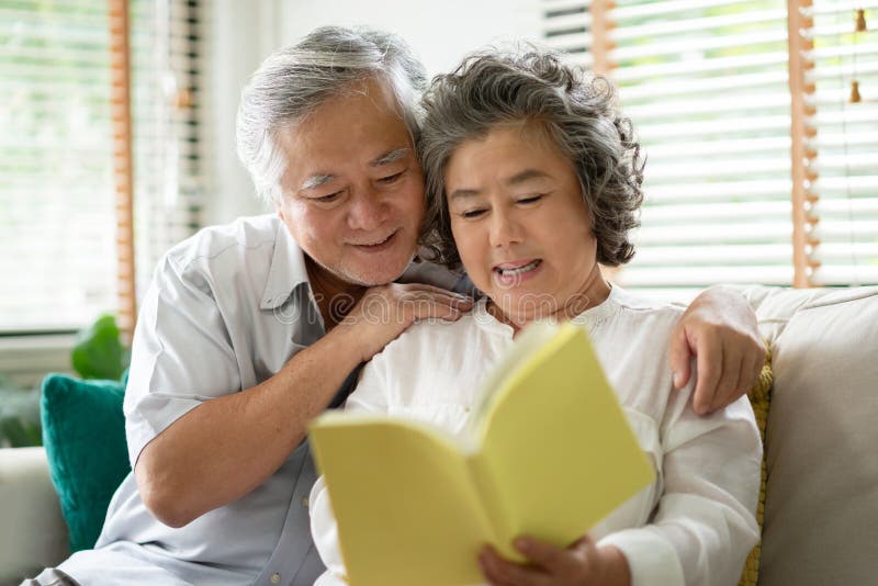 Senior Couple reading a book.