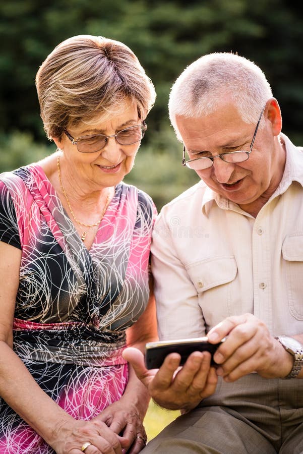Senior Couple With Smartphone Stock Image Image Of Couple Sitting 44303103