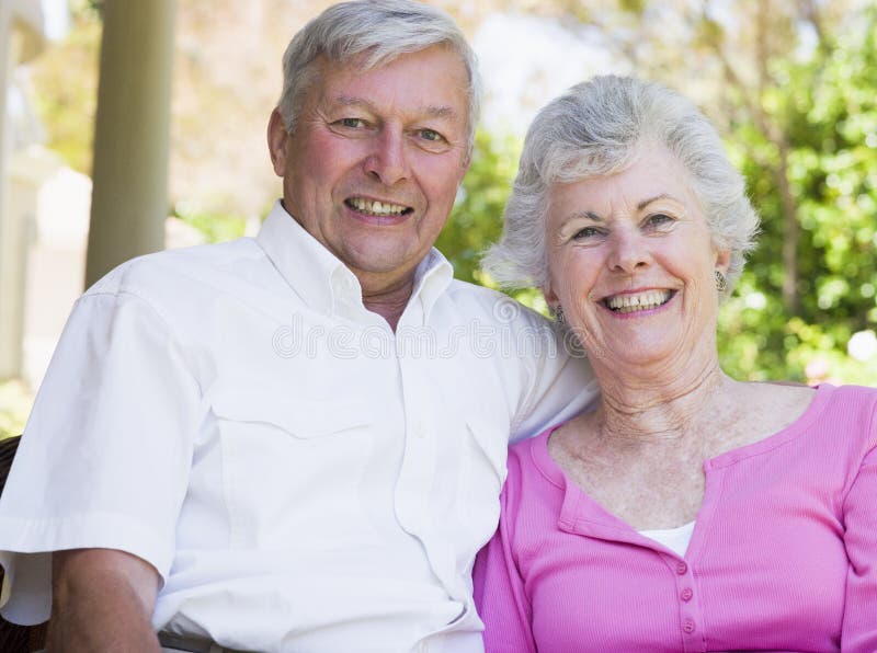 Senior couple smiling at camera
