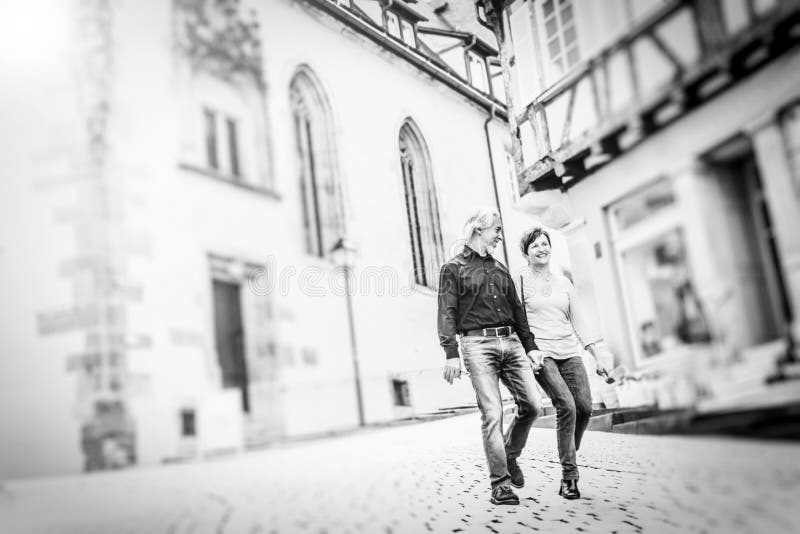 Senior Couple Walking Through The Streets Of Tuebingen stock photo Senior Couple Walking Through The Streets Of Tuebingen stock photo