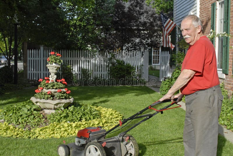 Senior Ctizen Mowing Lawn stock photo. Image of architecture 5275152