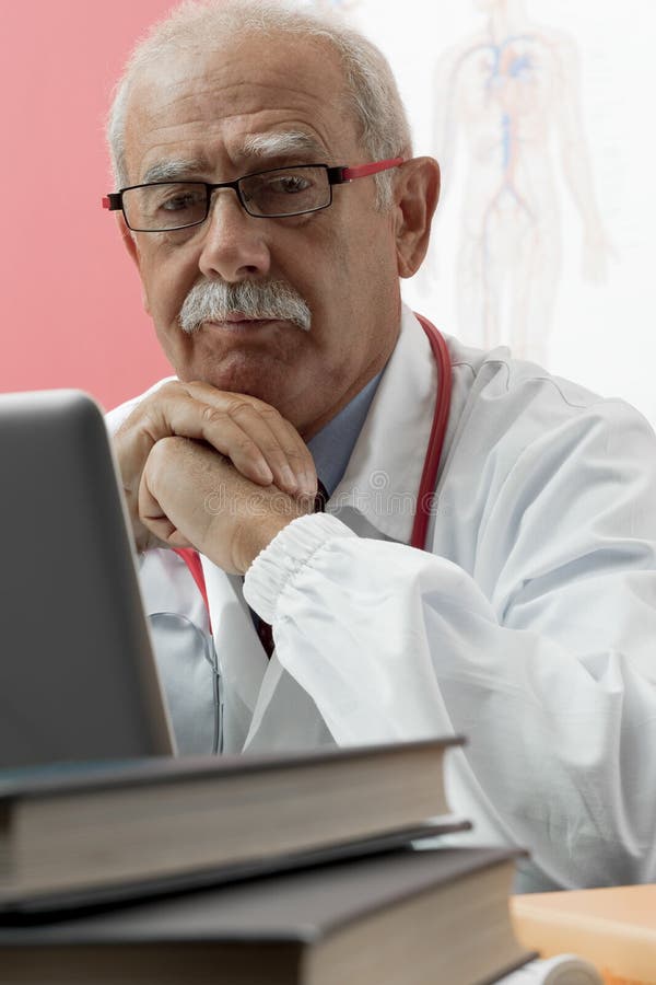 Senior Doctor Using Webcam