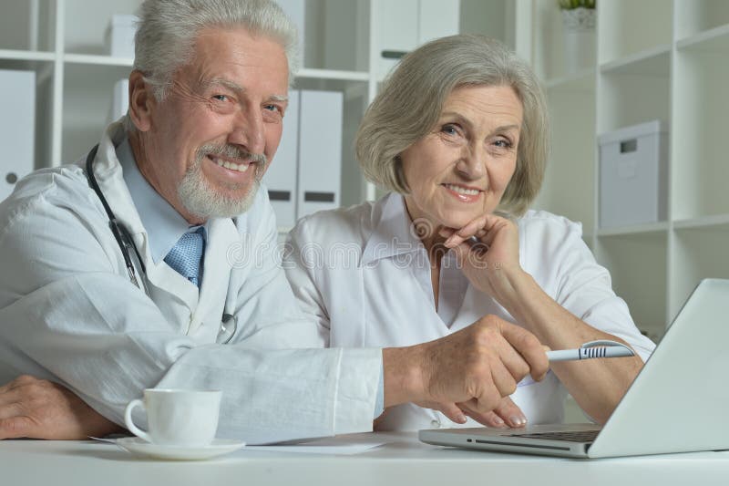 Senior Doctors with laptop