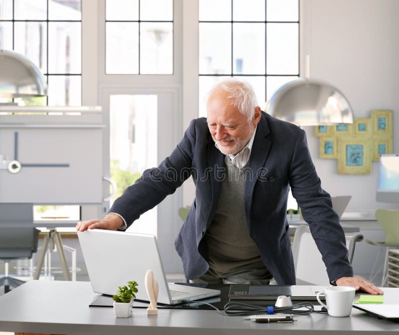 Senior engineer working with computer at office