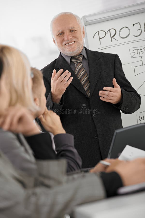 Senior Executive Shaking Hands with Young Employee Stock Image Image