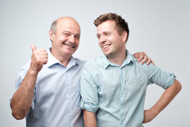 Senior father is proud of his mature son. stock photography Senior father is proud of his mature son. stock photography