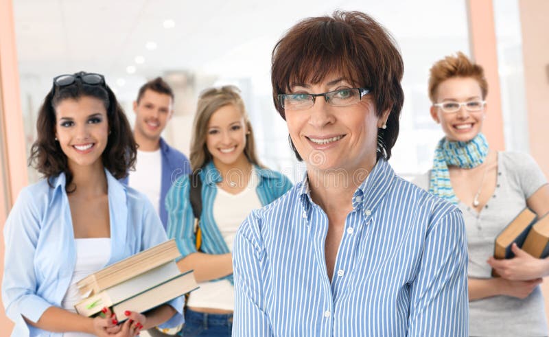 Senior female teacher with group of students royalty free stock image Senior female teacher with group of students royalty free stock image