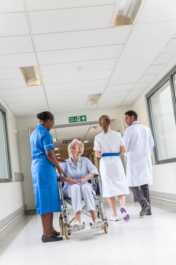 Senior Female Woman Patient in Wheelchair & Nurse in Hospital royalty free stock photography Senior Female Woman Patient in Wheelchair & Nurse in Hospital royalty free stock photography