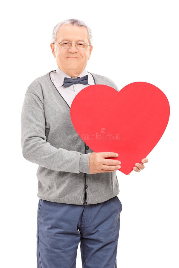 Senior gentleman holding a red heart