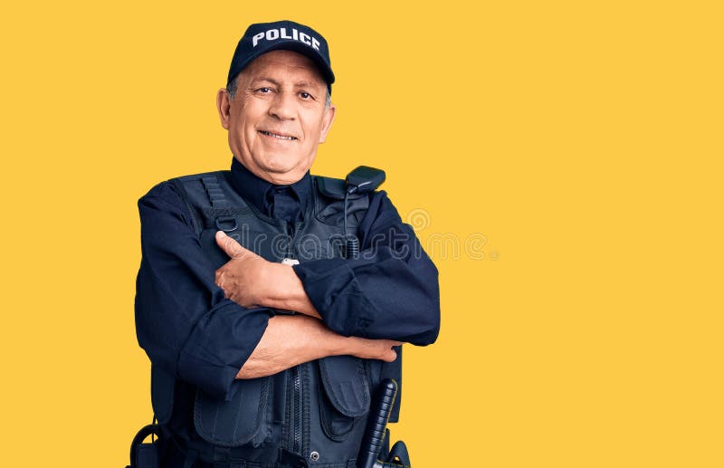 Senior handsome man wearing police uniform happy face smiling with crossed arms looking at the camera