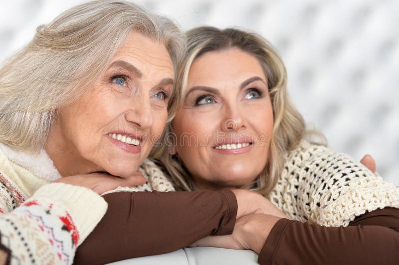 Portrait of two smiling senior and mature women looking at the distance. Portrait of two smiling senior and mature women looking at the distance