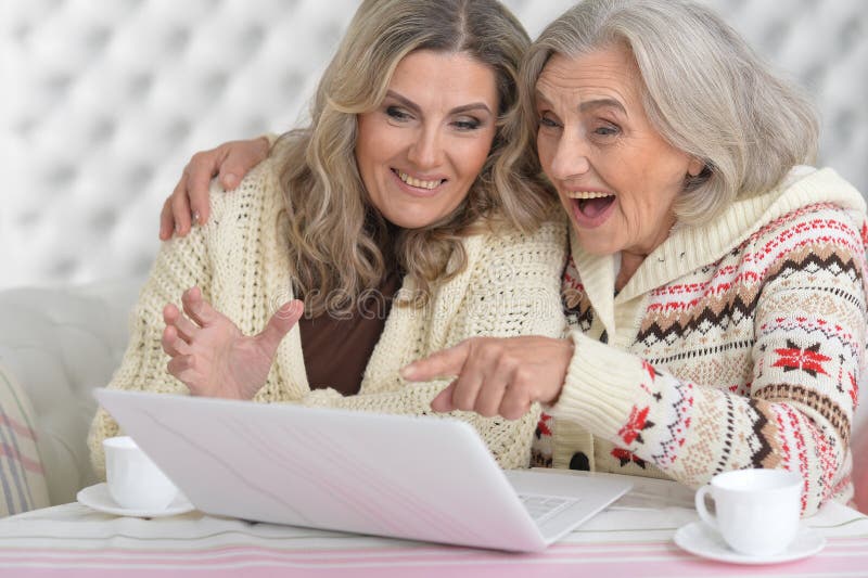 Portrait of senior and mature women with laptop. Portrait of senior and mature women with laptop