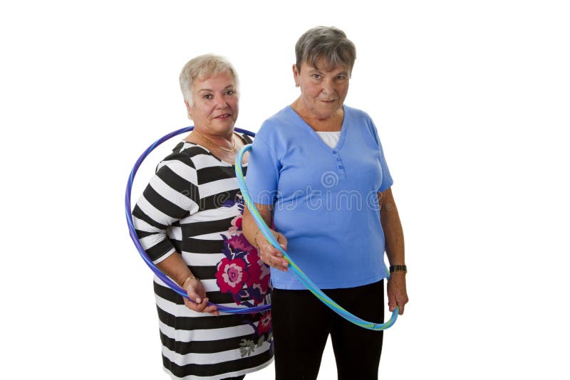 Senior lady doing gymnastic with hula hoop