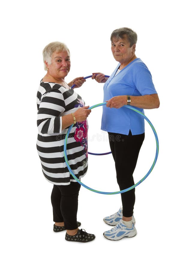 Senior lady doing gymnastic with hula hoop