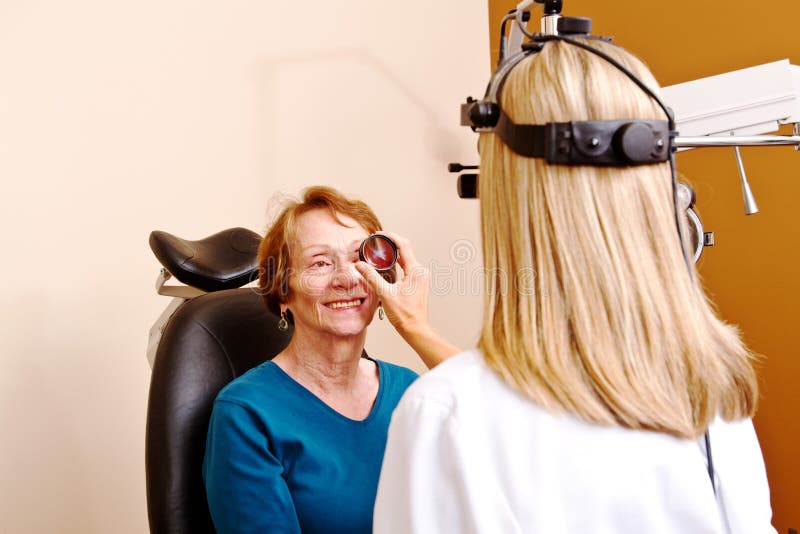 Senior lady having eye check up stock image