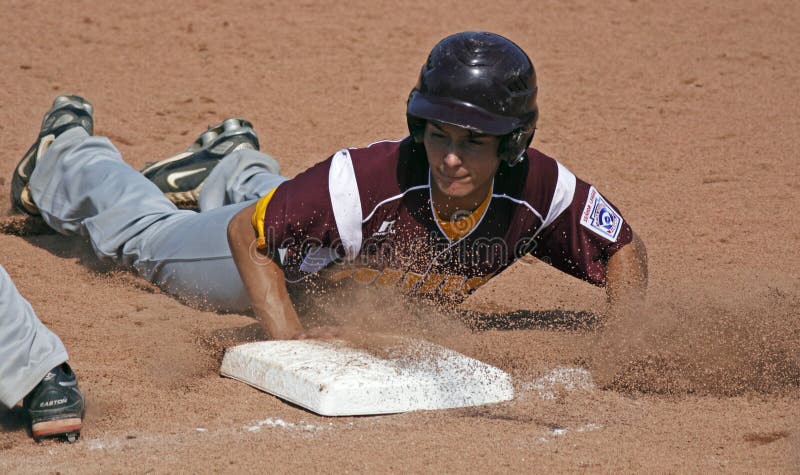 Kenny Rhodes of US Southeast (Palm Bay, Florida) slides safely back to first base at the Senior League Baseball World Series against Asia-Pacific (Tanauan City, Philippines) August 18, 2011 in Bangor, Maine. Kenny Rhodes of US Southeast (Palm Bay, Florida) slides safely back to first base at the Senior League Baseball World Series against Asia-Pacific (Tanauan City, Philippines) August 18, 2011 in Bangor, Maine.