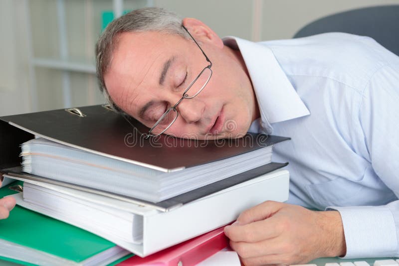 Senior male accountant sleeping on table stock photos Senior male accountant sleeping on table stock photos